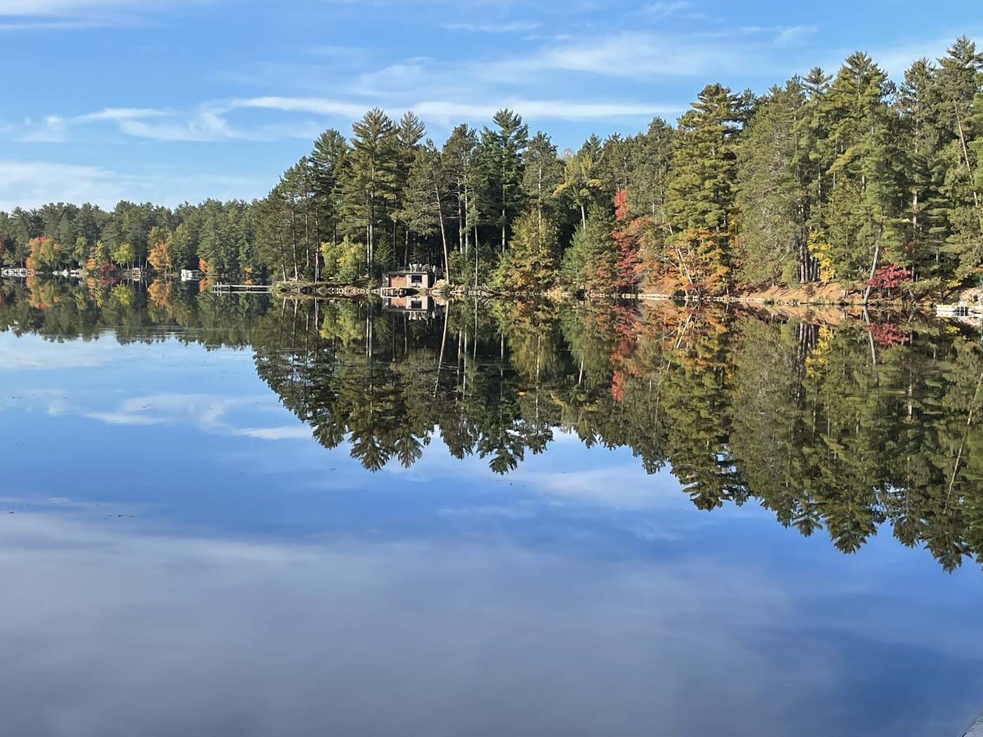 Reflective lake view surrounded by pines near Eagle River, Wisconsin
