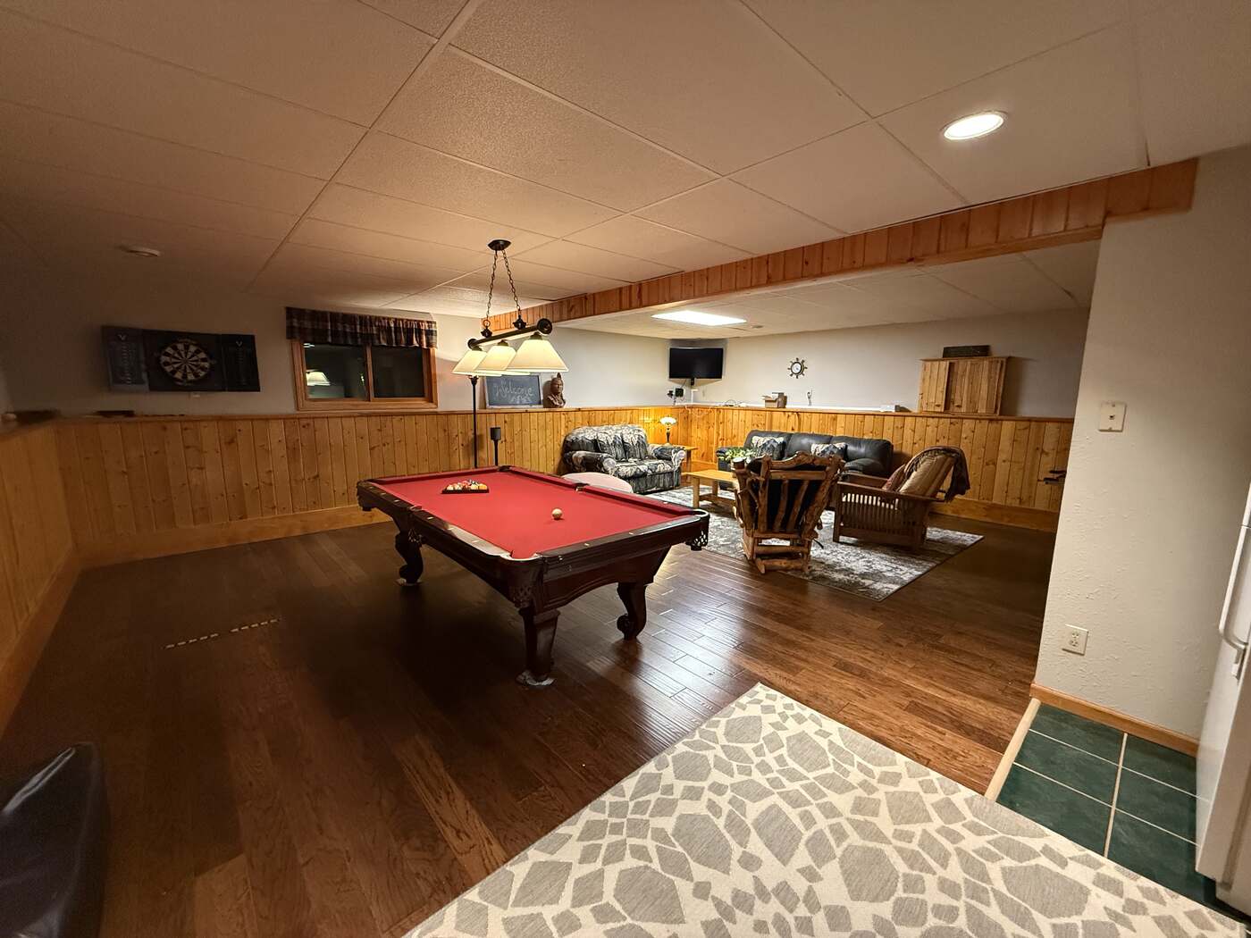 Game room with pool table and dart board
